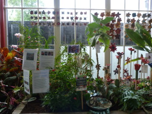 Painted clay flowers with real plants.